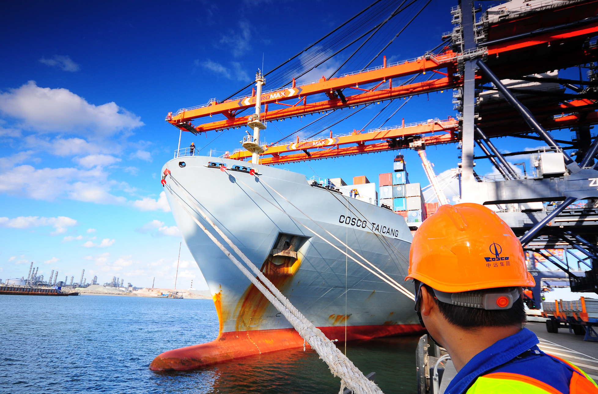 Workman at sea observing maritime work